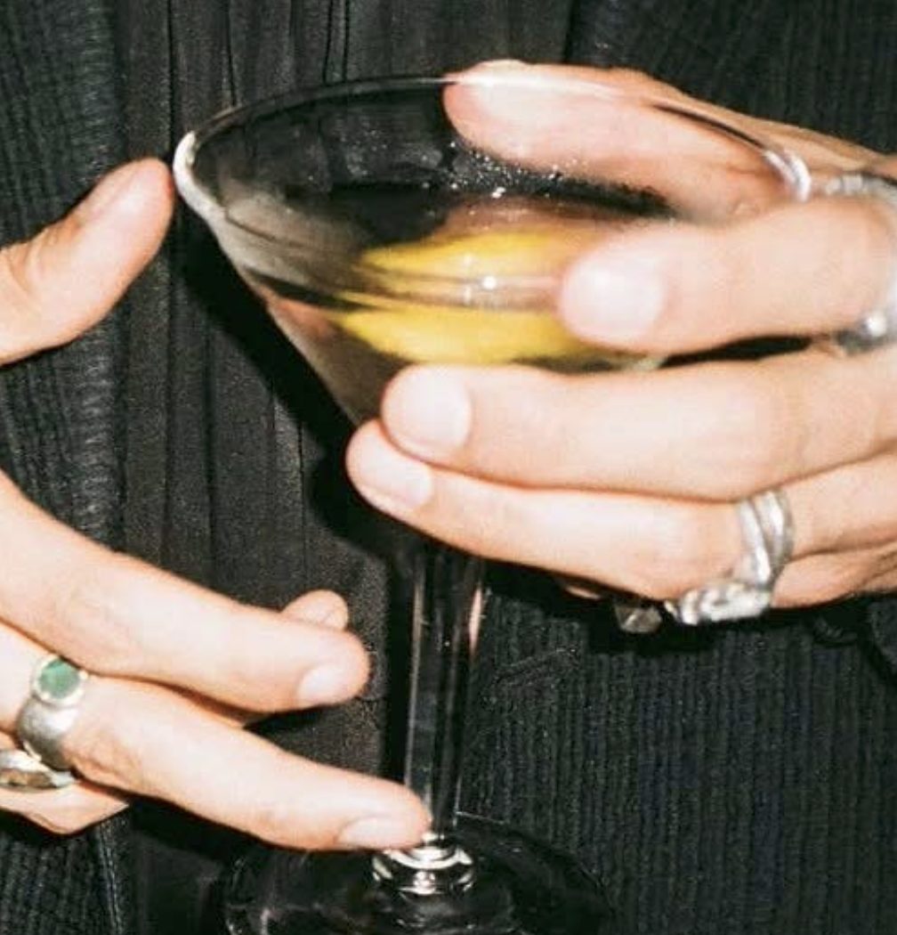 Hands holding a martini
